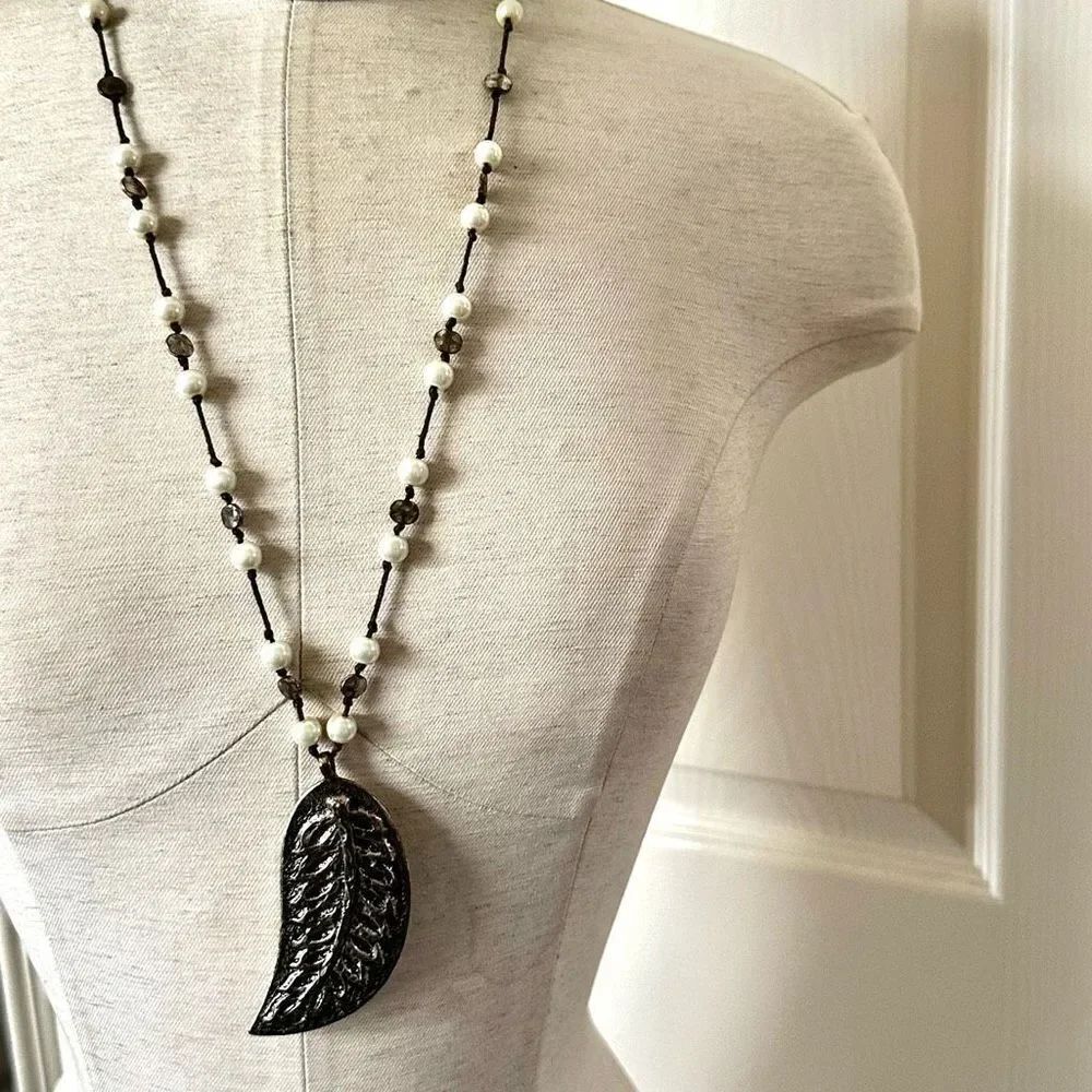 Long leaf pendant on faux pearl cord